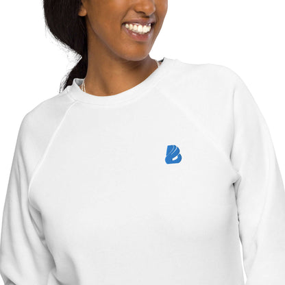 Smiling person wearing Unisex Bio-Raglan-Pullover N°1 with soft fleece lining and 100% organic cotton exterior for comfort and style.