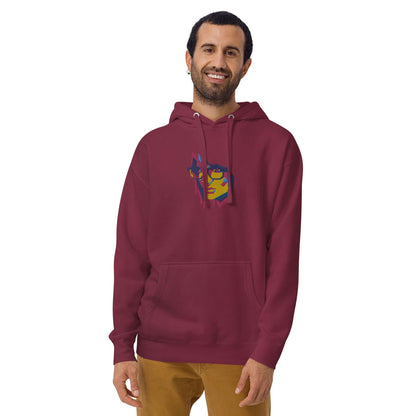 Unisex-Kapuzenpullover N°39 in burgundy with graphic design, featuring kangaroo pocket and drawstring hood, worn by a smiling person.