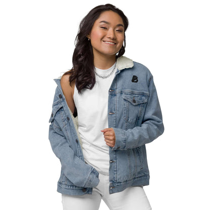 Model wearing Unisex Sherpa Jeansjacke N°2, a classic denim jacket with warm Sherpa lining, showcasing style and eco-friendly materials.